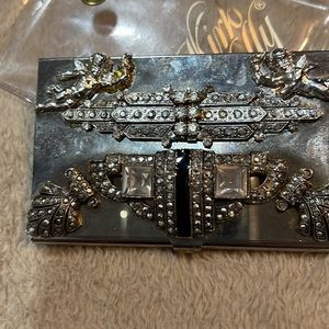 Kirks Folly a gem of a card holder Encrusted w/ stones & 2 cupids so charming